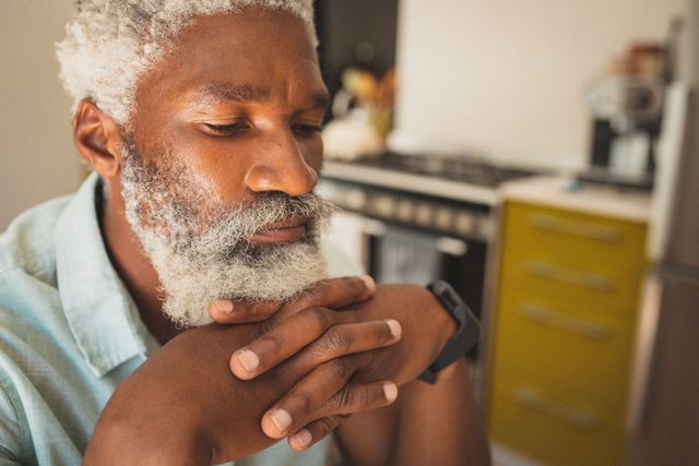 Senior African American Man Relaxing in Kitchen - Download Free Stock Images Pikwizard.com