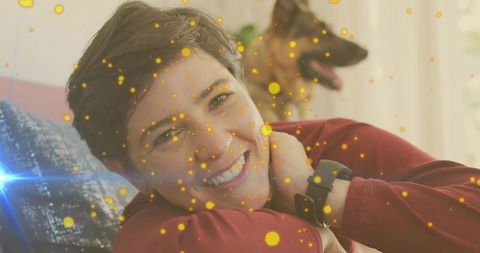 Smiling Woman Relaxing at Home with Loyal German Shepherd