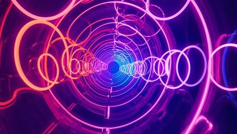 Glowing Neon Ring Tunnel Receding Toward Electric Blue Center Futuristic Abstract Light