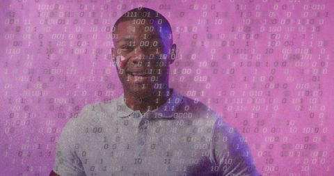 Smiling man with binary code overlay on vibrant background