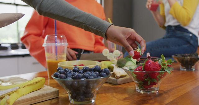 Friends Making Healthy Smoothies with Fresh Fruit - Download Free Stock Images Pikwizard.com