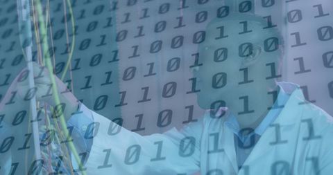 African American Technician in Server Room with Binary Overlay