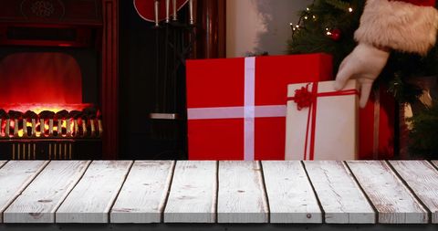 Festive christmas scene with santa gifts by fireplace
