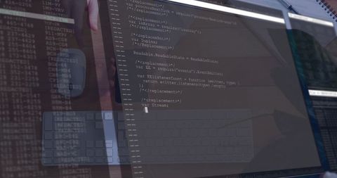 Developer Debugging JavaScript on Glossy Monitor with Keyboard Reflection and Terminal