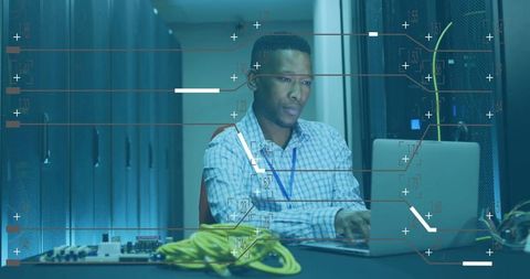 Focused IT Technician Managing Data and Networks in High-Tech Server Room