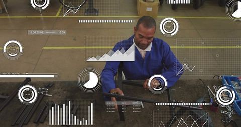 Industrial technician repairing metal frame with ar analytics overlays, factory workflow