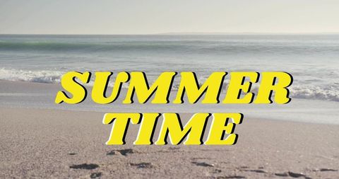 Retro yellow summer time typography dominating serene sandy beach with waves