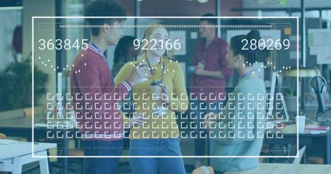 Young professionals collaborating in open office with augmented data overlay and analytics