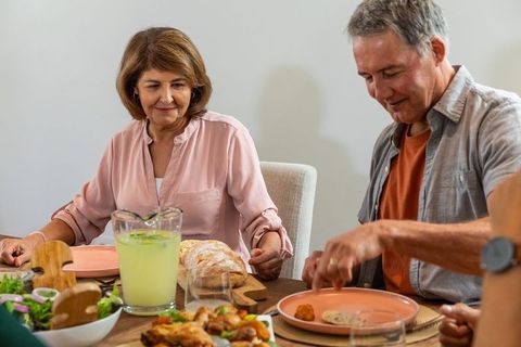 Senior Couple Enjoying Cozy Family Dinner at Home
