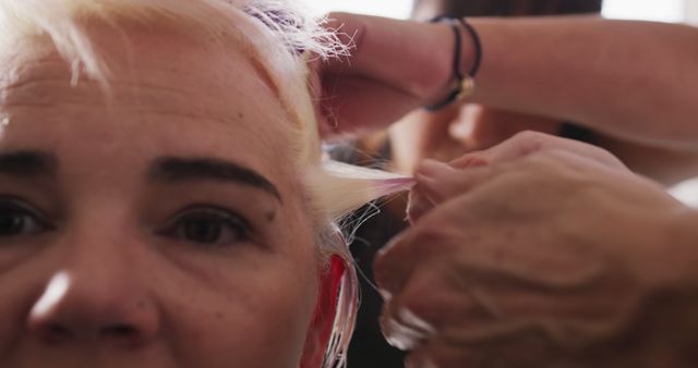 Close-Up of Hairdresser Highlighting Client's Hair - Download Free Stock Images Pikwizard.com