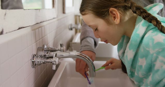 Young Girl Practising Dental Hygiene at Bathroom Sink - Download Free Stock Images Pikwizard.com