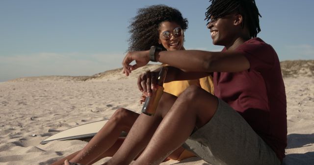 Couple Relaxing on Sand Beach with Surfboard and Drinks, Enjoying Summer - Download Free Stock Images Pikwizard.com