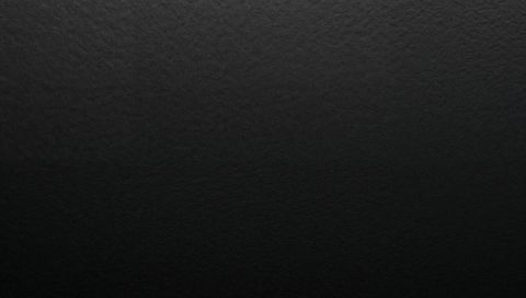 Textured Charcoal Surface with Subtle Gradient and Fine Pebbled Grain High-Res Matte Black Backdrop