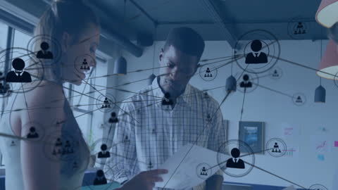 Diverse Professionals Analyzing Network Insights in Modern Office