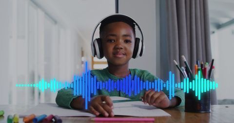 Young Boy Learning with Headphones in Educational Setting