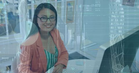 Smiling BusinesswomanUsing Computer at Desk with Digital Interface Overlay