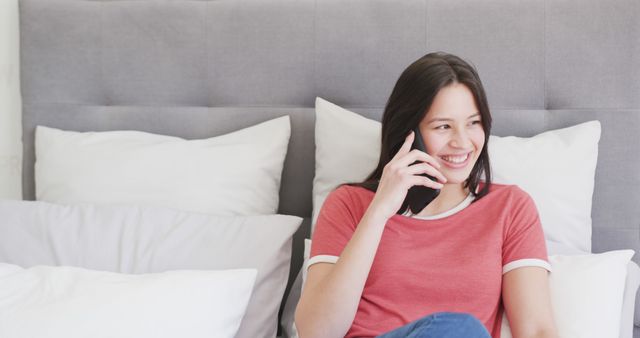 Smiling Woman Talking on Phone While Relaxing in Bed - Download Free Stock Images Pikwizard.com