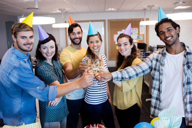 Creative business team having a toast on colleges birthday - Download Free Stock Photos Pikwizard.com