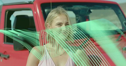 Blonde Woman by Red SUV with Digital Effects in Desert