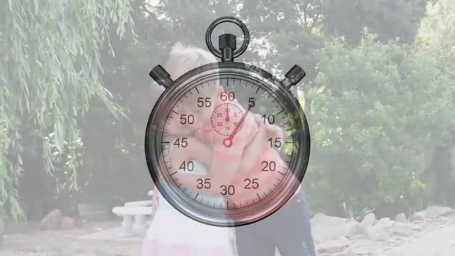 Kids Hugging with Stopwatch Overlay in Garden