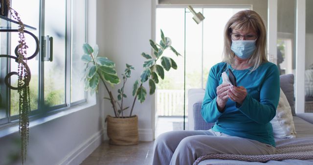 Senior woman checking temperature at home - Download Free Stock Images Pikwizard.com