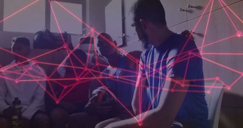 Athletic team bonding with neon overlay effects in locker room