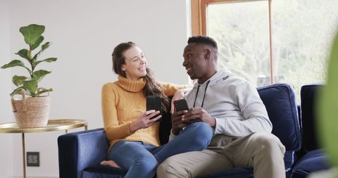 Happy Diverse Couple Shopping Online Together