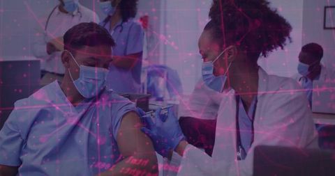 Clinician administering vaccine to masked patient in clinic with magenta network overlay
