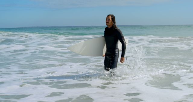 Man walking with surfboard on the sea at beach 4k - Download Free Stock Photos Pikwizard.com