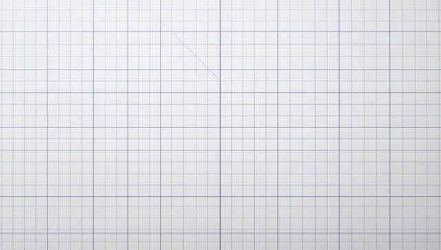 Showing white graph paper with light-blue grid, central fold crease, minimal geometry