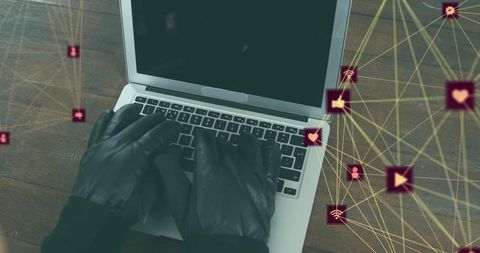 Cybersecurity Threats Depicted by Gloved Hands on Laptop