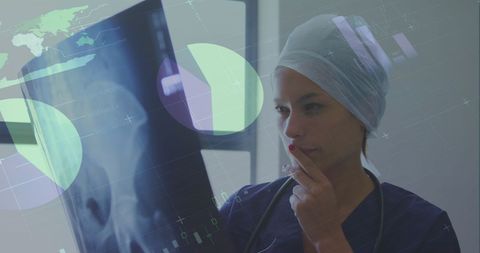 Medical Technology: Doctor Analyzing X-Ray with Digital Infographics - Download Free Stock Images Pikwizard.com
