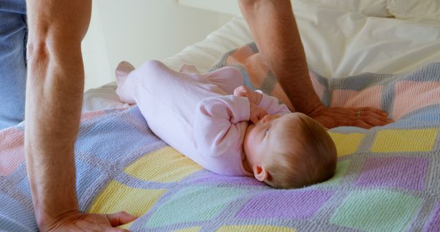 Father Watching Newborn Baby Lying on Bed - Download Free Stock Images Pikwizard.com