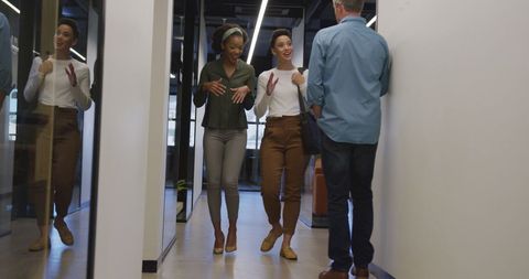 Happy Diverse Businesspeople Walking Through Office Hallway - Download Free Stock Images Pikwizard.com