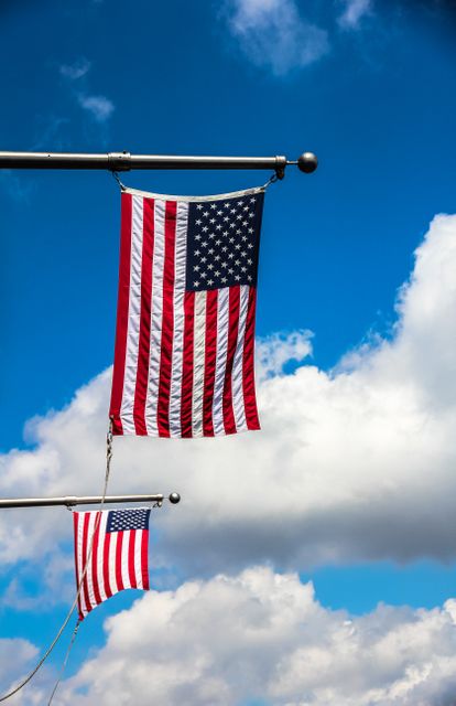 American Flags Waving on Poles against Blue Sky and Clouds - Download Free Stock Photos Pikwizard.com