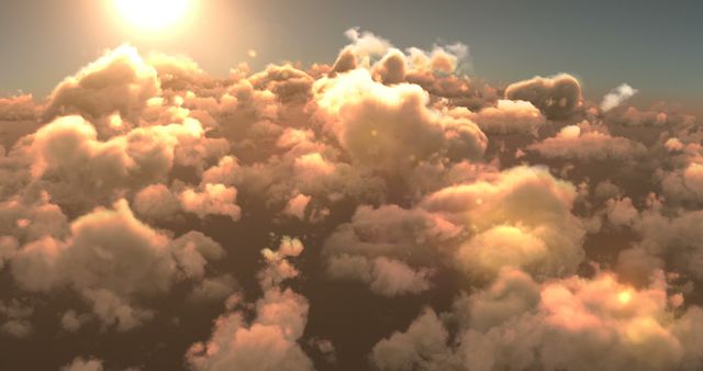 Sunlight bathes a sea of fluffy clouds in a warm glow, creating a serene and majestic skyscape. This image captures the ethereal beauty of nature's skyscape, often associated with tranquility and inspiration.