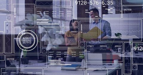 Colleagues collaborating over analytics dashboards in modern open-plan office