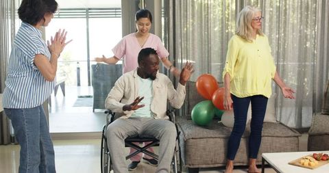 Diverse Healthcare Team Welcoming New Wheelchair User Patient