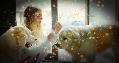 Woman Bonding with Dogs in Cozy Home Environment