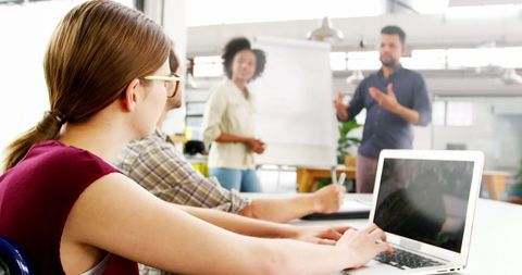 Diverse Team in Casual Office Working Together