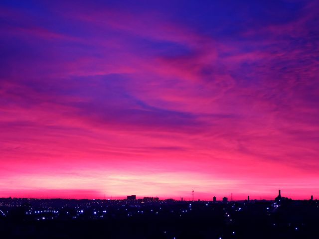 Vibrant Purple and Pink Sunset Over Silhouetted Cityscape - Download Free Stock Photos Pikwizard.com