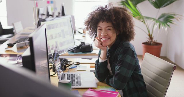 Smiling Professional Woman Working at Modern Office Desk with Computer - Download Free Stock Images Pikwizard.com