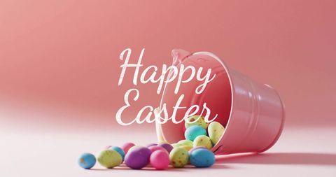 Easter eggs crawling from pink bucket with happy easter text overlay