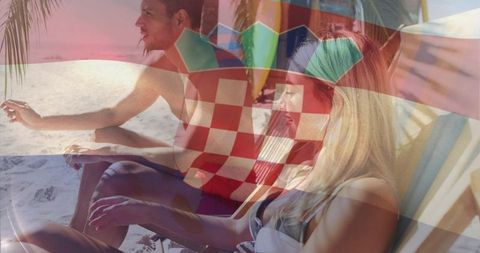 Couple relaxing on tropical beach with croatian flag overlay conveying summer travel vibe