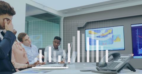 Business Team Analyzing Data with Graphs in Office Setting