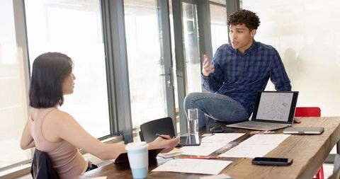Diverse Team Collaborating on Floor Plan Design in Modern Office