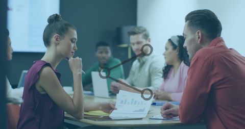Diverse Team Collaborating in Office with Share Icon Overlay