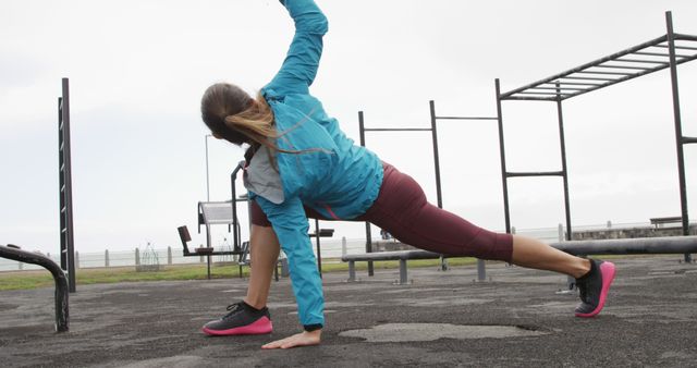 Woman Exercising Outdoors with Stretching Routine - Download Free Stock Images Pikwizard.com