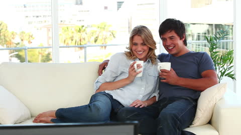 Happy Couple Enjoying Leisure Time Together at Home