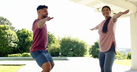 Diverse Couple Practicing Outdoor Yoga on Sunny Day